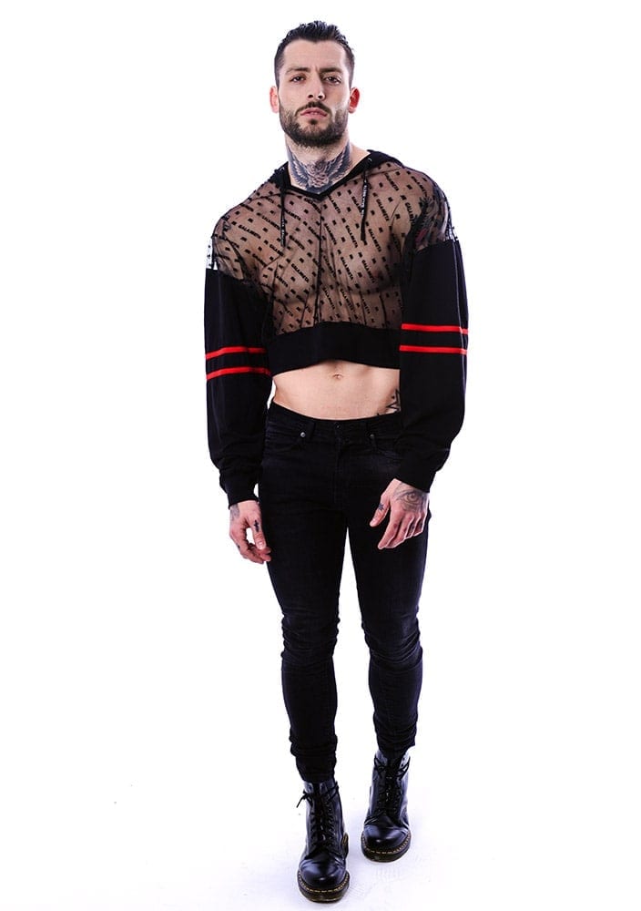 gay male wearing a total look of cropped top and black denim
