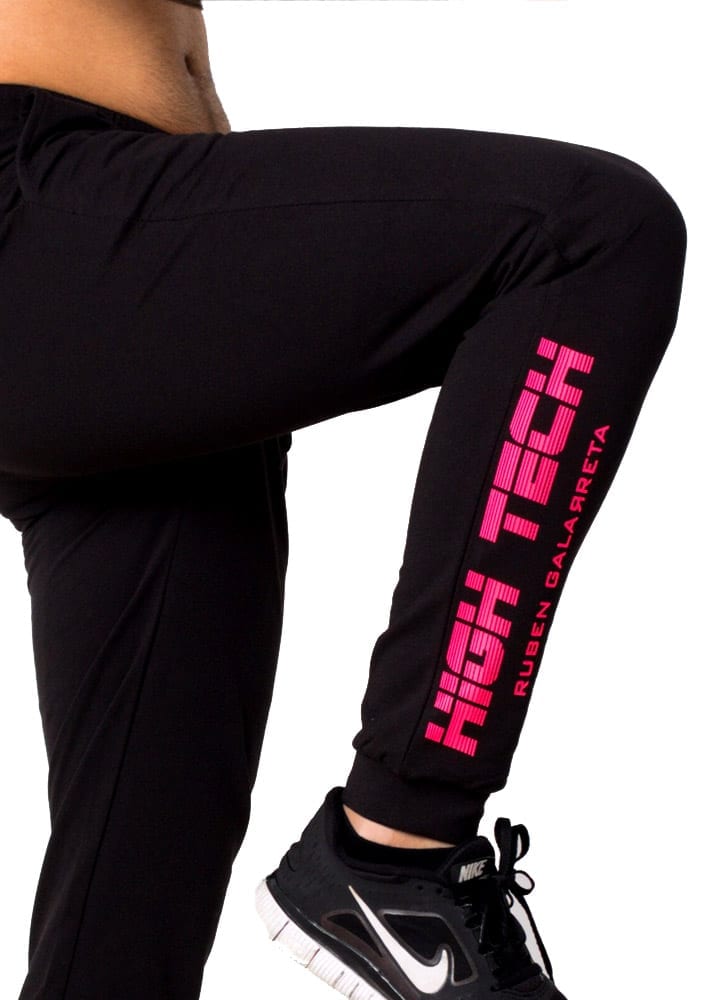 leg detail of neon pink print on black skinny jogger for man